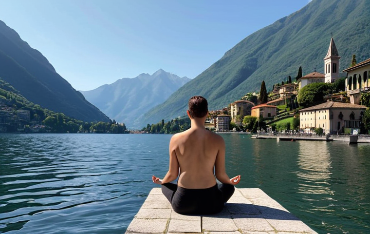 ** A person sitting peacefully by Lake Como, Italy, with mountains in the background, meditating. Focus on the serene atmosphere and the connection with nature.
**